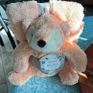 Cuddly soft animal and blanket.